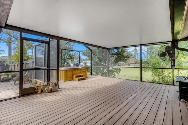 unfurnished sunroom featuring a wealth of natural light