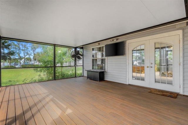 unfurnished sunroom featuring plenty of natural light and french doors