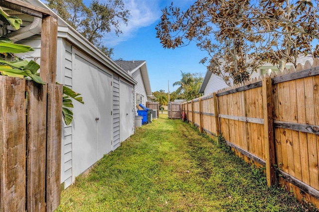 view of yard with a fenced backyard