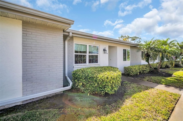 entrance to property with brick siding