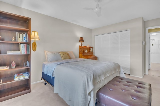 bedroom featuring a closet, carpet flooring, a ceiling fan, and baseboards