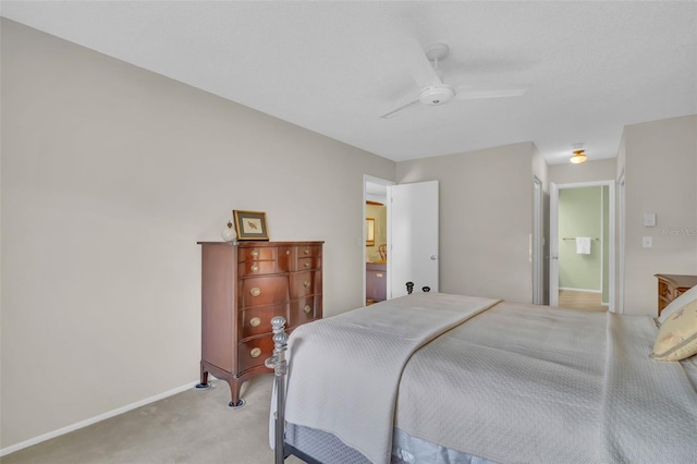 bedroom with ceiling fan, baseboards, and light colored carpet