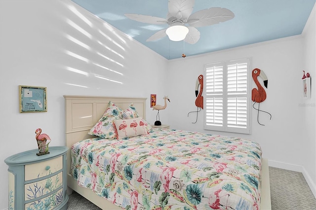 bedroom featuring carpet floors, baseboards, and a ceiling fan