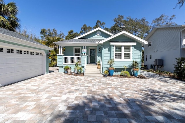 view of front of home with covered porch and central AC