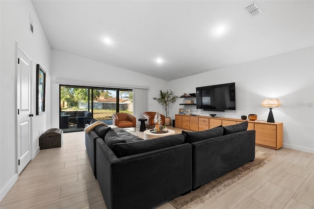 living room featuring light wood finished floors, recessed lighting, visible vents, vaulted ceiling, and baseboards