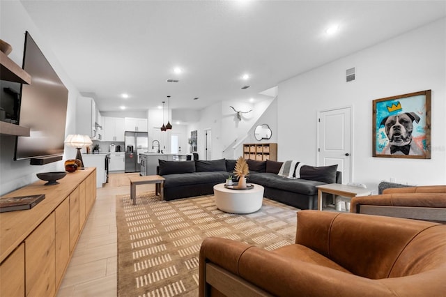 living room with visible vents and recessed lighting