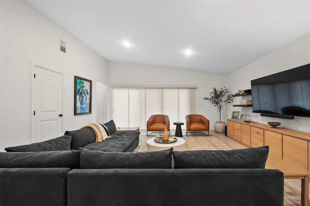 living room with vaulted ceiling, visible vents, and recessed lighting