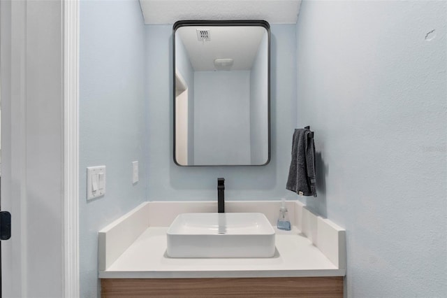 bathroom featuring visible vents and vanity