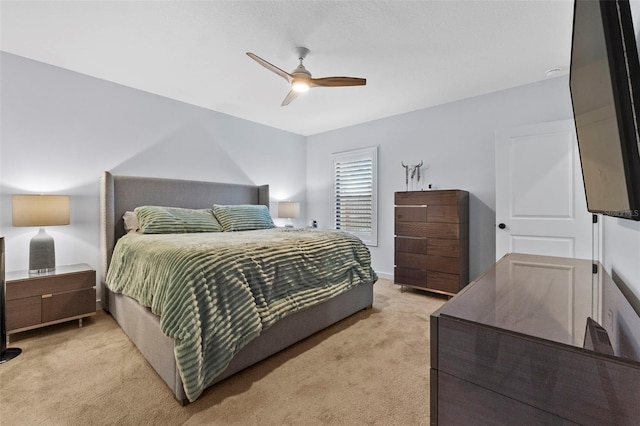 bedroom with light colored carpet and ceiling fan