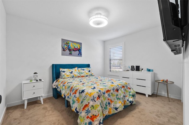 bedroom with baseboards and carpet flooring