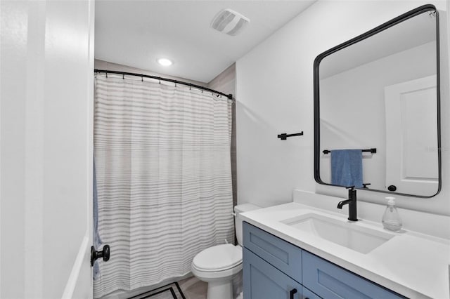 full bath with a shower with shower curtain, visible vents, vanity, and toilet