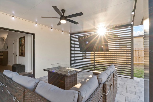 view of patio featuring a ceiling fan and outdoor lounge area