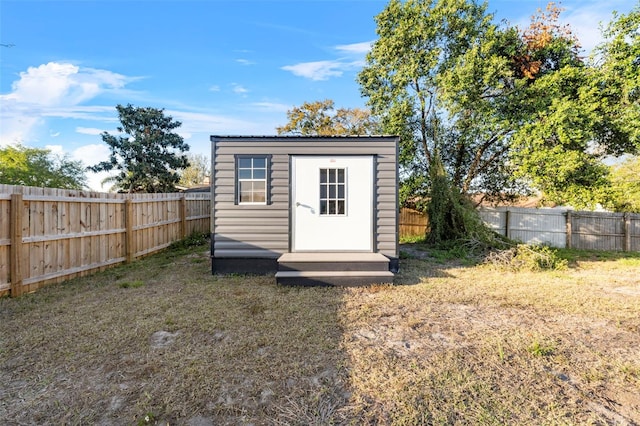 view of shed featuring a fenced backyard