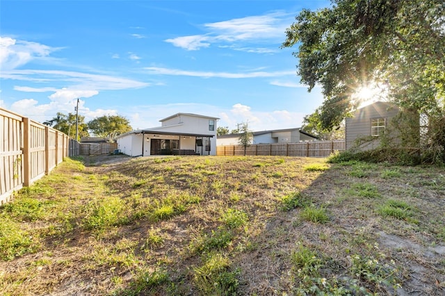 view of yard with a fenced backyard