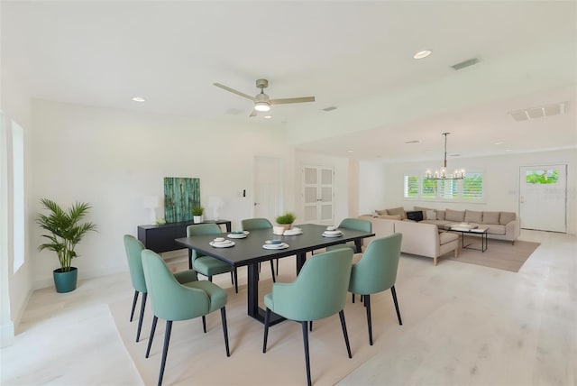 dining space featuring ceiling fan with notable chandelier, visible vents, and recessed lighting