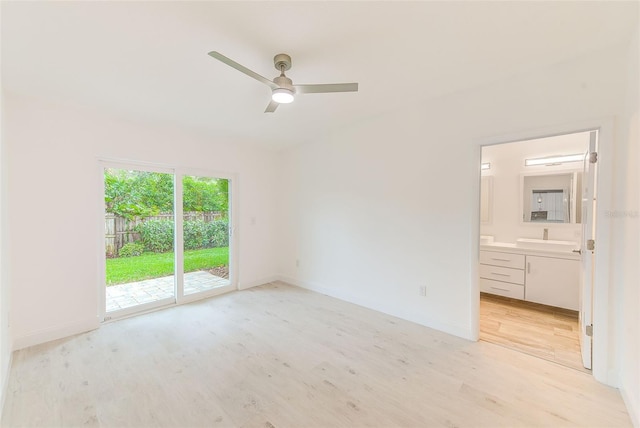 unfurnished bedroom featuring ensuite bathroom, light wood-style floors, ceiling fan, access to outside, and baseboards