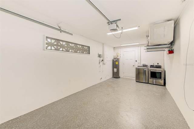 garage with washer and clothes dryer, electric water heater, and a garage door opener