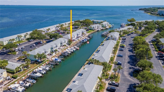 birds eye view of property with a water view and a residential view