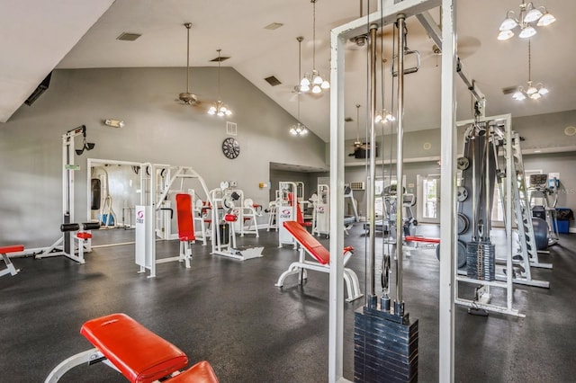 exercise room with a ceiling fan, visible vents, and high vaulted ceiling