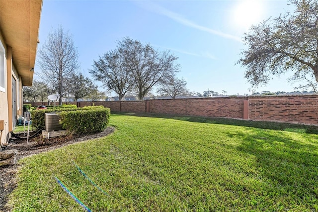 view of yard with a fenced backyard