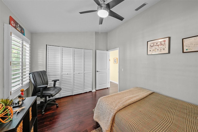 bedroom with lofted ceiling, ceiling fan, wood finished floors, visible vents, and a closet