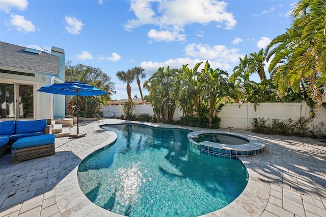 view of pool with an outdoor hangout area, a patio, a fenced backyard, and a pool with connected hot tub