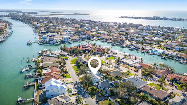 birds eye view of property featuring a residential view and a water view