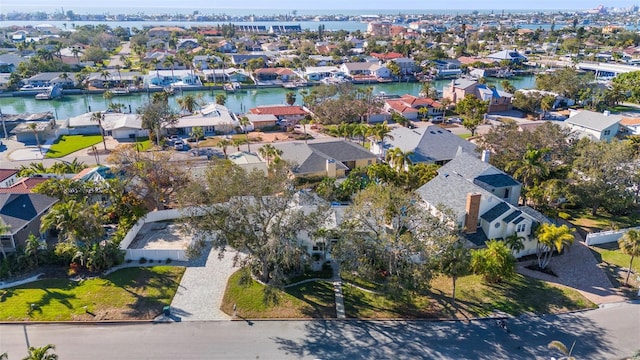 birds eye view of property featuring a water view and a residential view