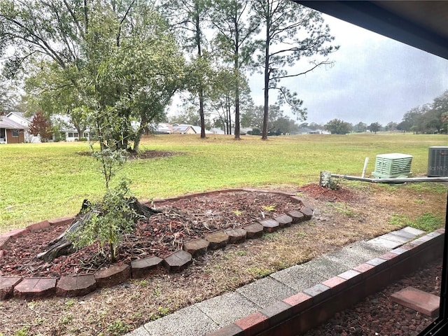 view of yard with a rural view and cooling unit