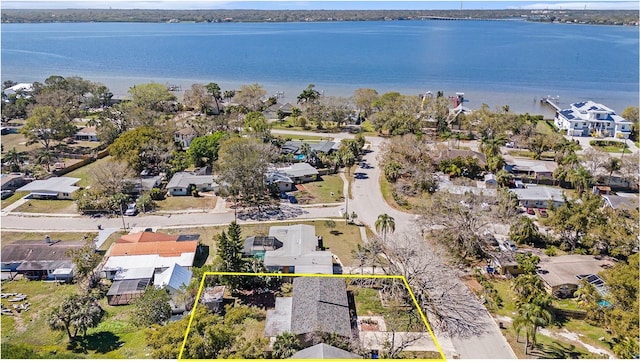 birds eye view of property with a residential view and a water view