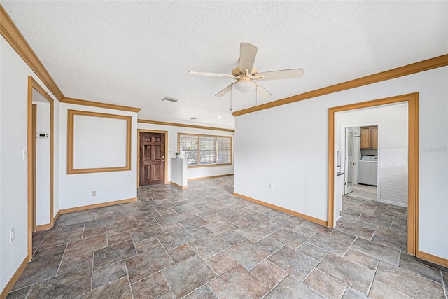 unfurnished room with visible vents, washer / clothes dryer, a textured ceiling, and ornamental molding