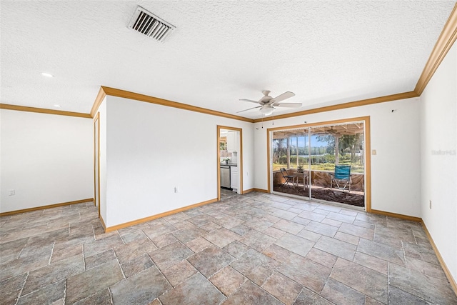 empty room with ornamental molding, visible vents, a textured ceiling, and baseboards