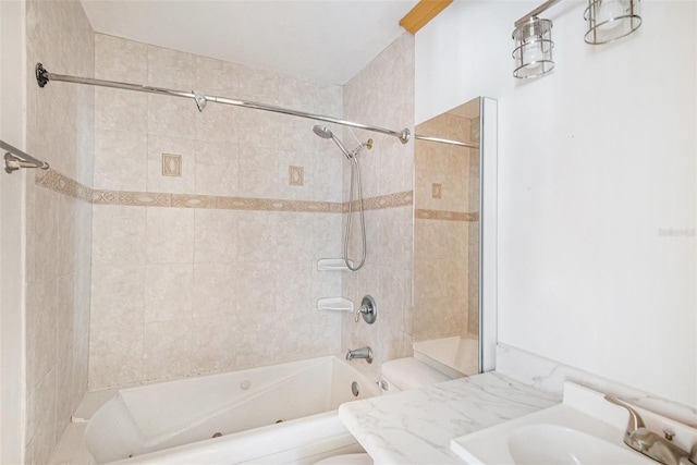 bathroom featuring shower / bathing tub combination, vanity, and toilet