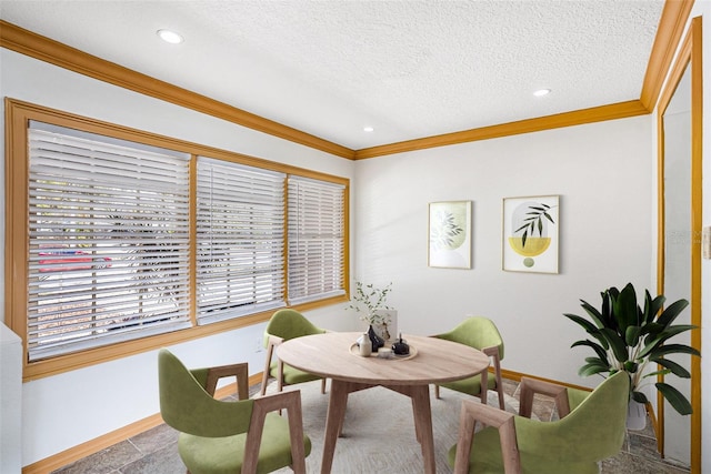 interior space with a textured ceiling, recessed lighting, baseboards, and crown molding