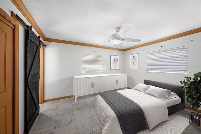 bedroom with ceiling fan, a textured ceiling, a barn door, baseboards, and crown molding