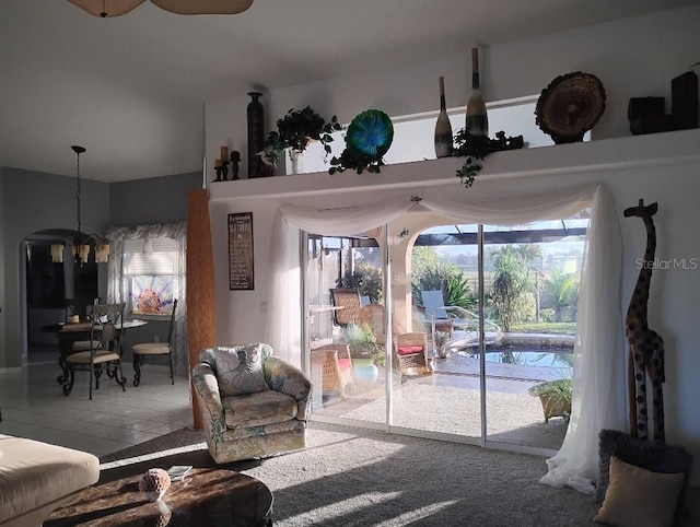 living area with ceiling fan