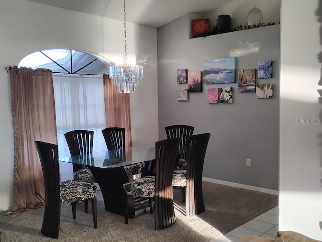 dining area with baseboards and an inviting chandelier