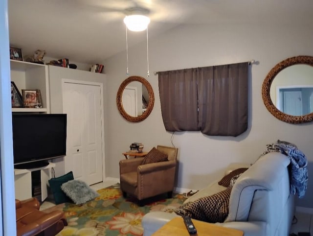 living room featuring vaulted ceiling