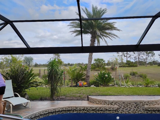 view of pool featuring a lanai, a patio area, and a lawn