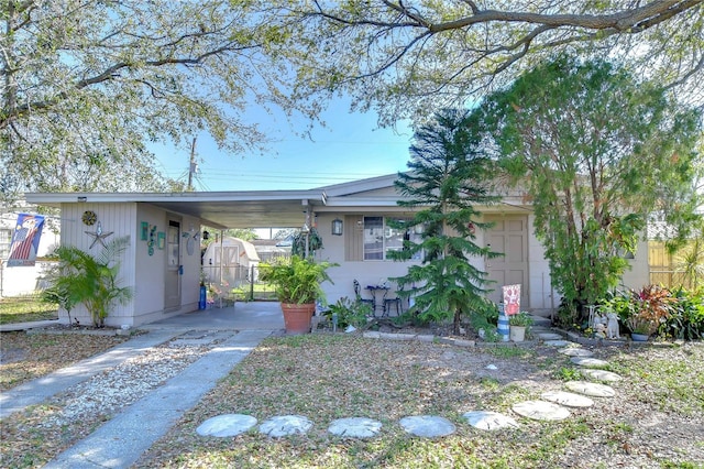 view of front of property featuring a carport