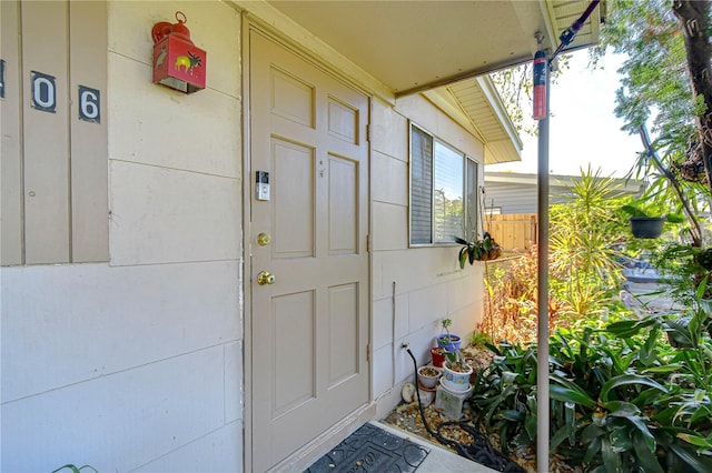 doorway to property with fence