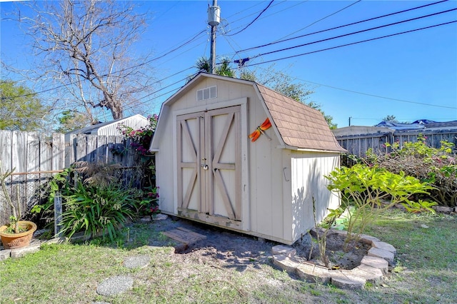 view of shed featuring a fenced backyard