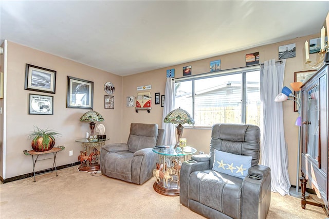 living area with carpet floors and baseboards