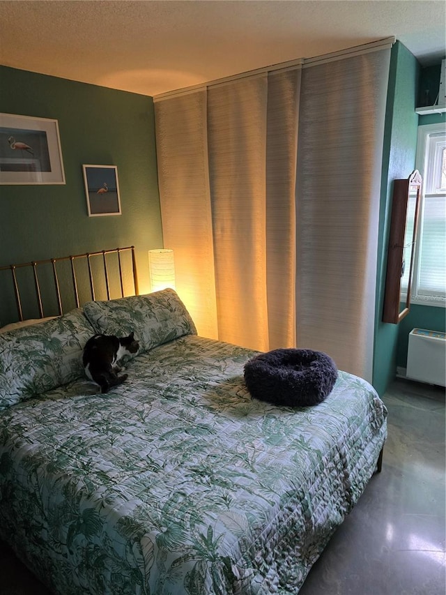 bedroom with finished concrete floors