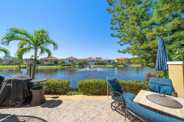 view of patio / terrace with a water view