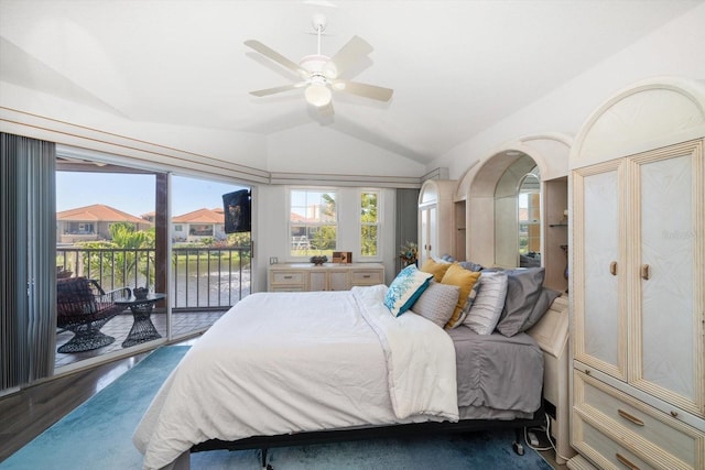 bedroom featuring lofted ceiling, access to outside, multiple windows, and a ceiling fan