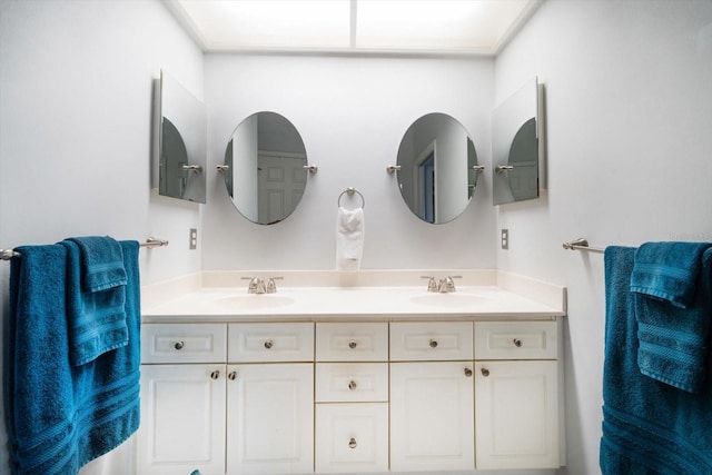 full bathroom featuring double vanity and a sink