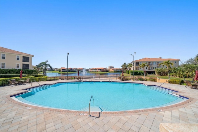 view of swimming pool with a patio