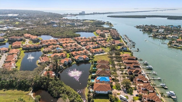 bird's eye view with a water view and a residential view