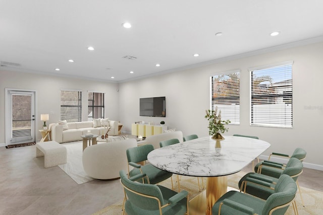 dining room featuring baseboards, ornamental molding, visible vents, and recessed lighting